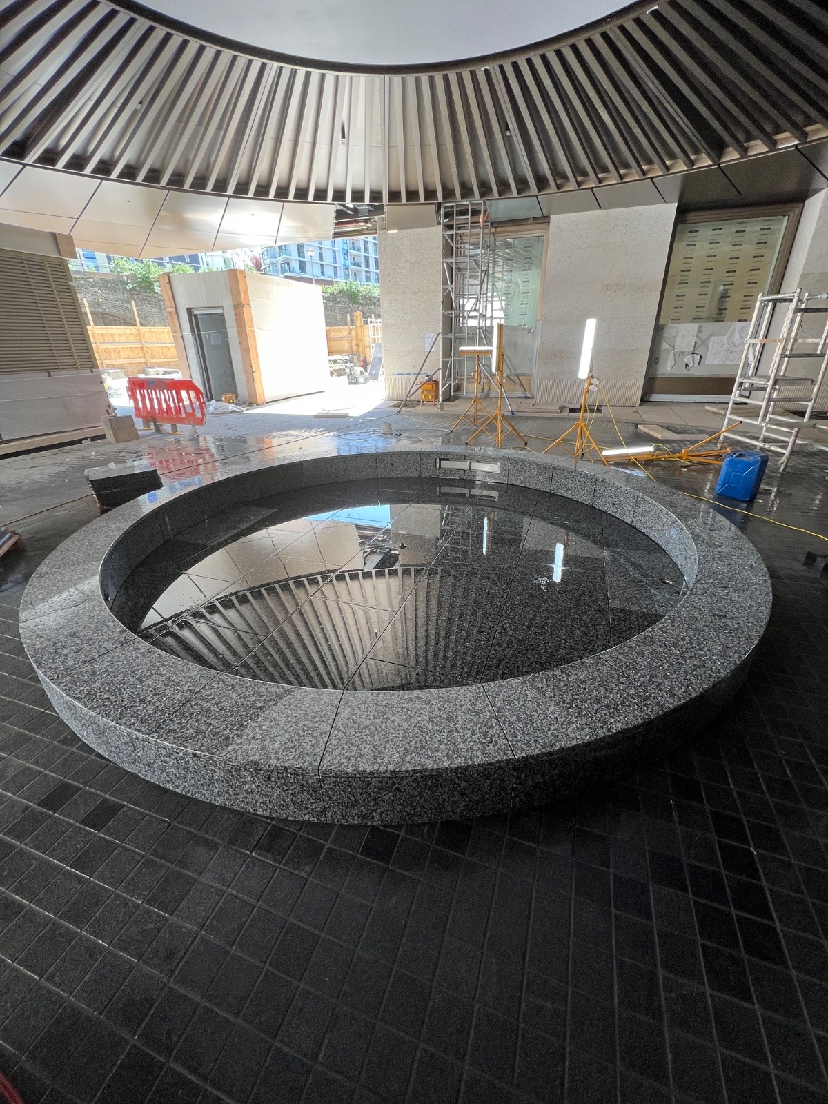 Commercial circular granite water feature in construction